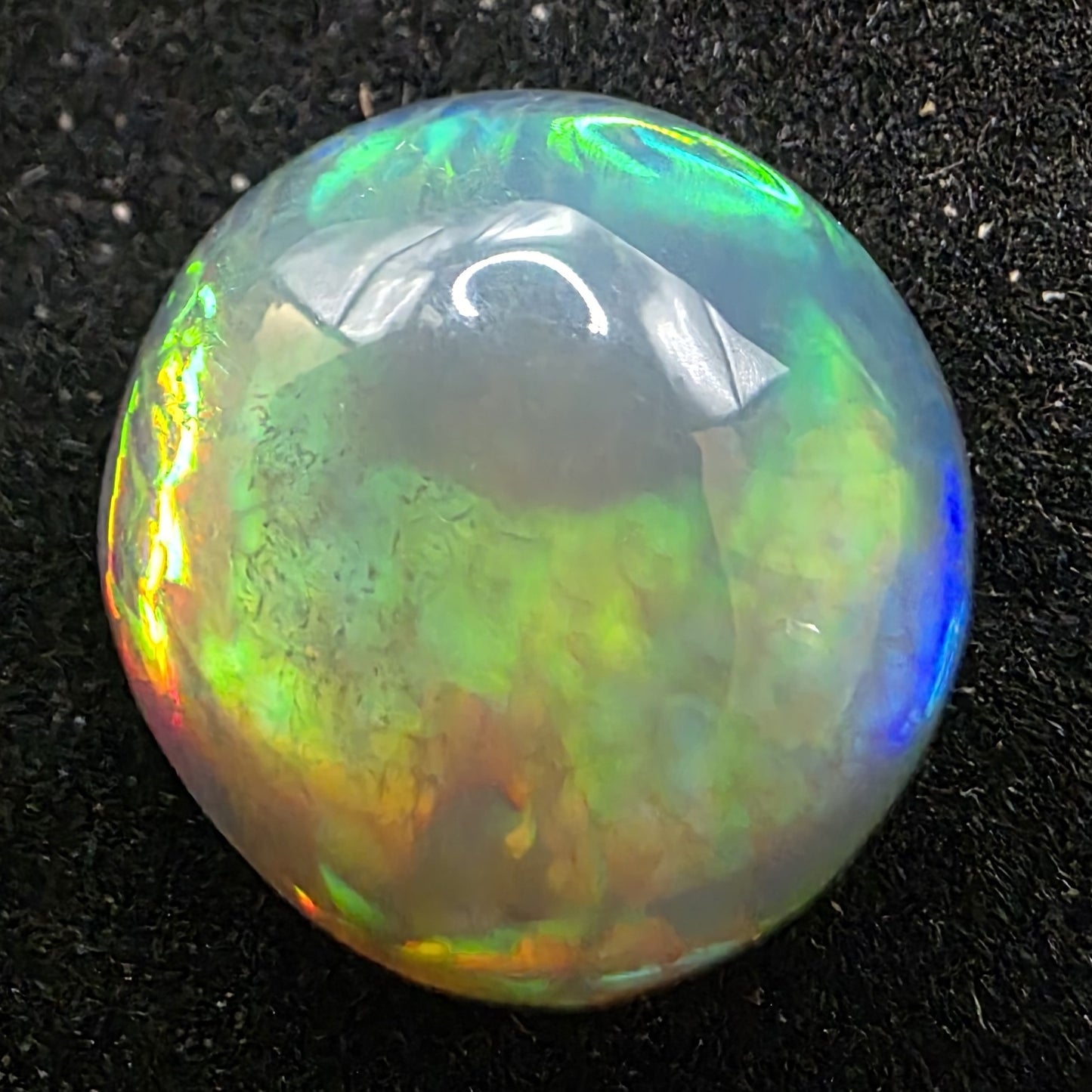 Black Opal special Ethiopian Welo, 5.75 ct round polished, natural, intense Play-of-Colour