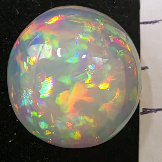 White Opal special Ethiopian Welo, 11.2 ct round polished, natural, intense Play-of-Colour