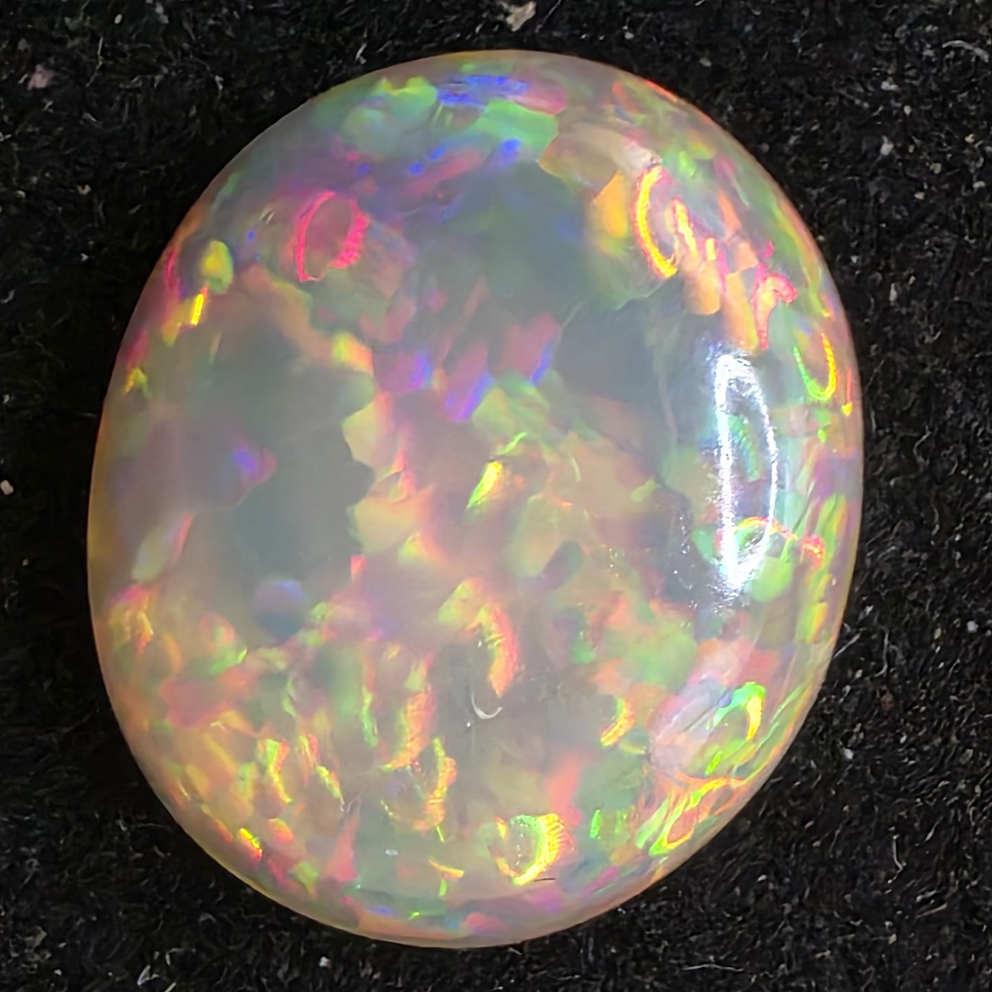 Black Opal special Ethiopian Welo, 6.65 ct oval polished, natural, intense Play-of-Colour