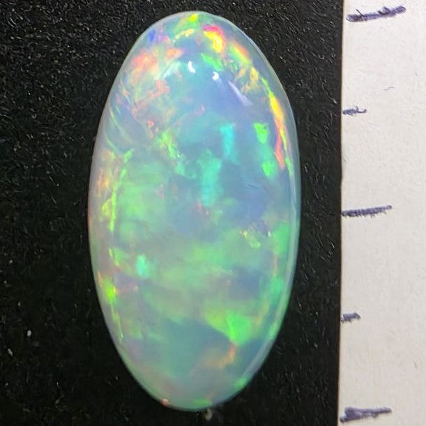 White Opal special Ethiopian Welo, 5.3 ct oval polished, natural, intense Play-of-Colour
