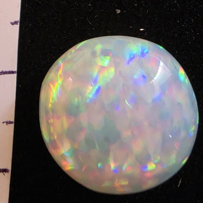 White Opal special Ethiopian Welo, 8.55 ct round polished, natural, intense Play-of-Colour