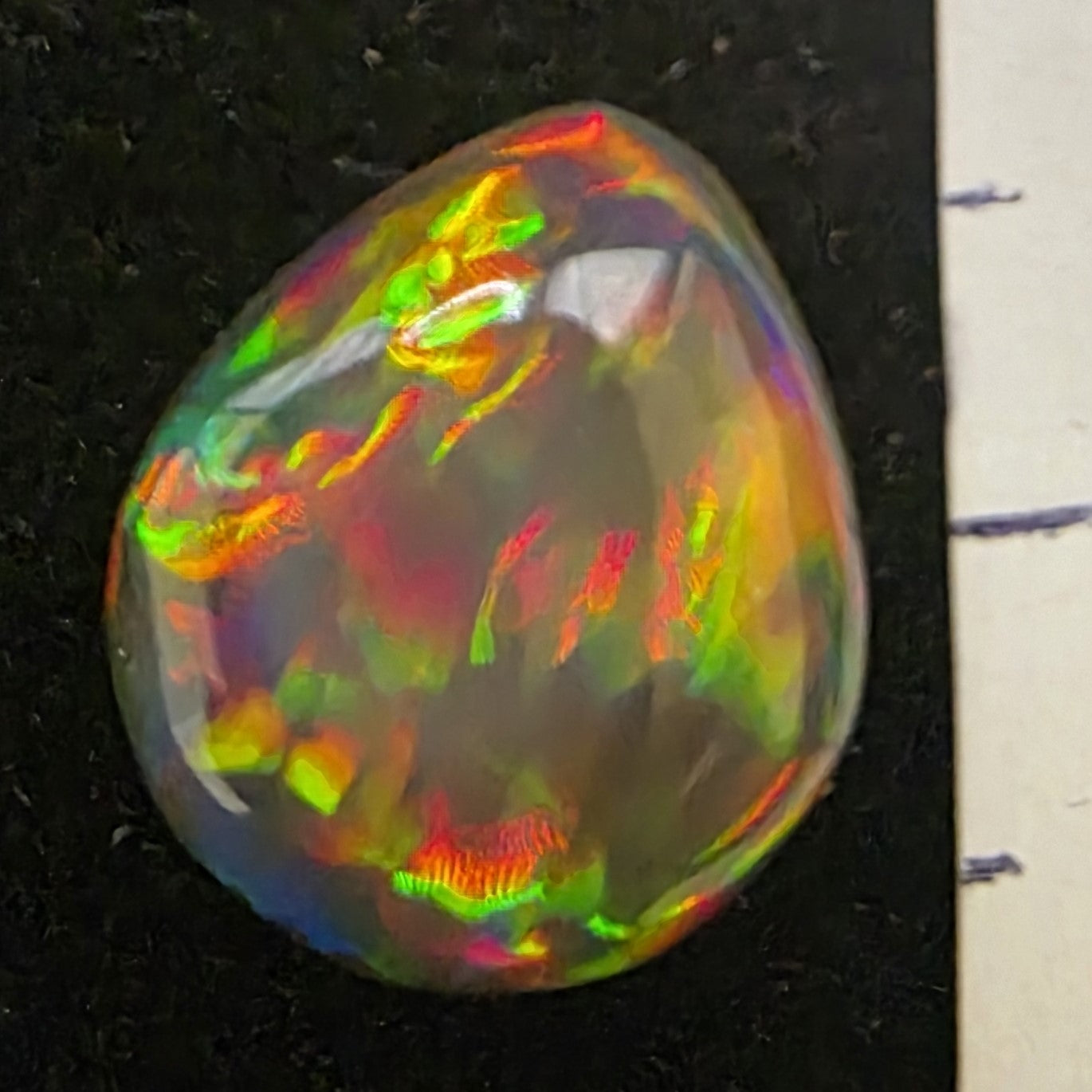 Black Opal special Ethiopian Welo, 3.7 ct pear polished, natural, intense Play-of-Colour
