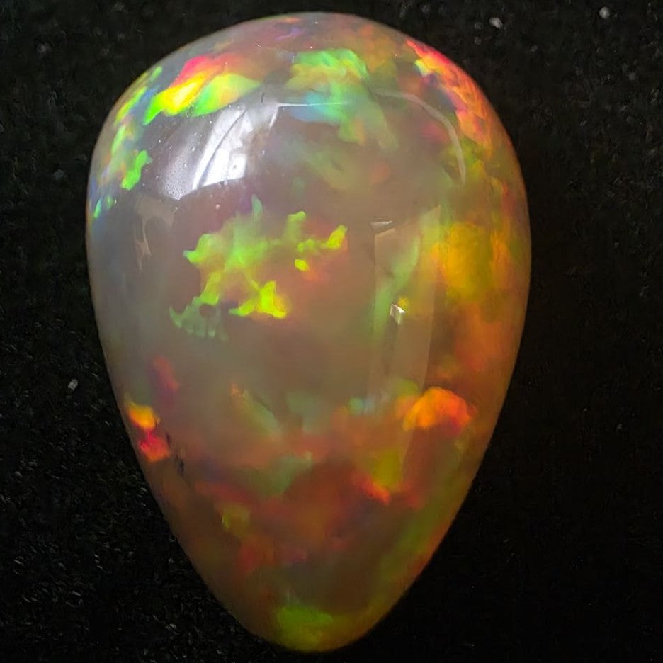 Black Opal special Ethiopian Welo, 23.55 ct pear polished, natural, intense Play-of-Colour