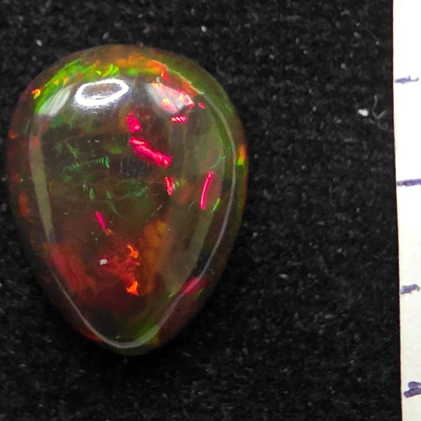 Black Opal special Ethiopian Welo, 4.7 ct pear polished, natural, intense Play-of-Colour