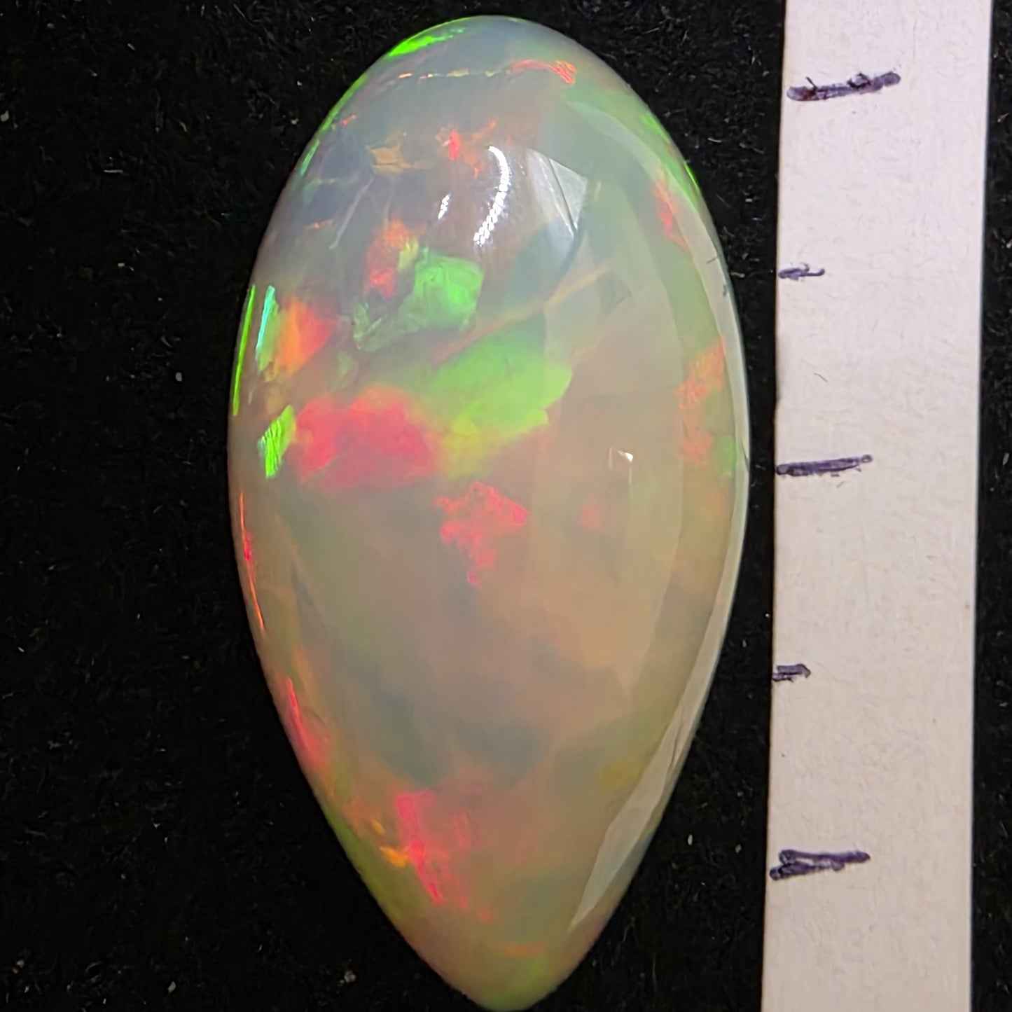 White Opal special Ethiopian Welo, 10.75 ct pear polished, natural, intense Play-of-Colour