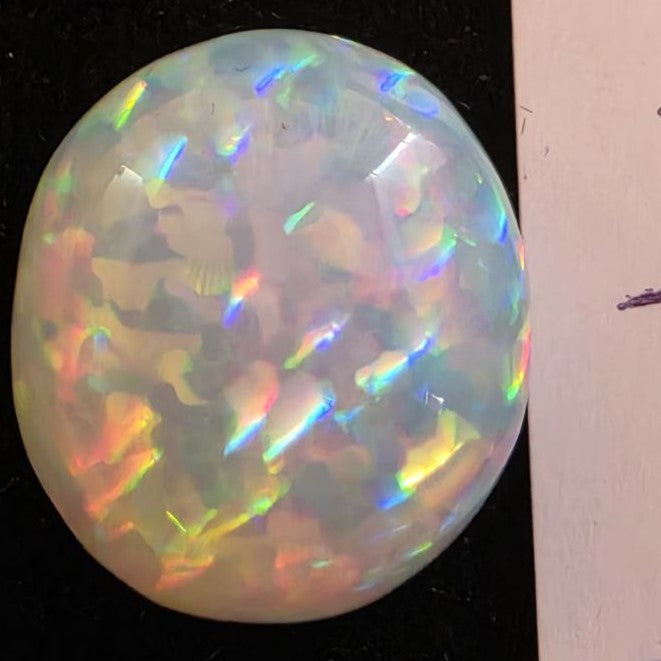 White Opal special Ethiopian Welo, 8.55 ct round polished, natural, intense Play-of-Colour