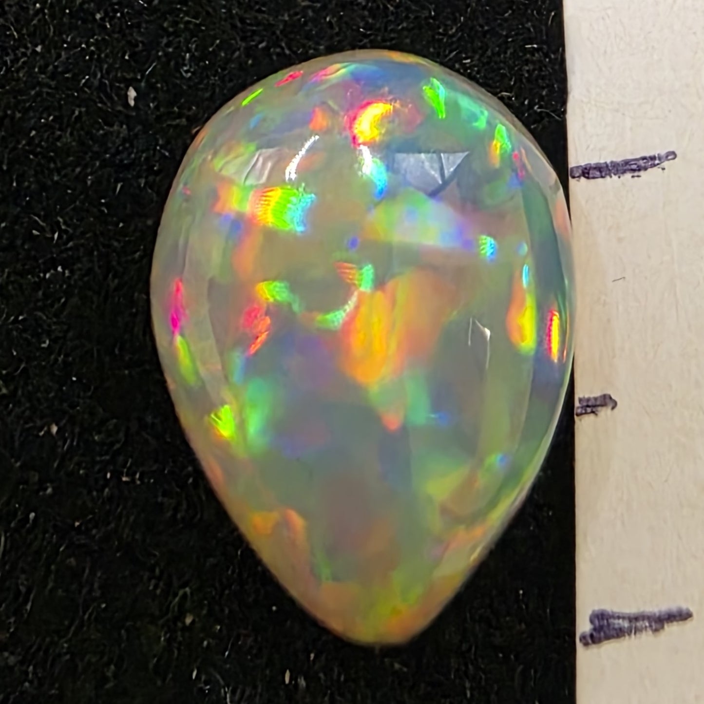 White Opal special Ethiopian Welo, 3 ct pear polished, natural, intense Play-of-Colour