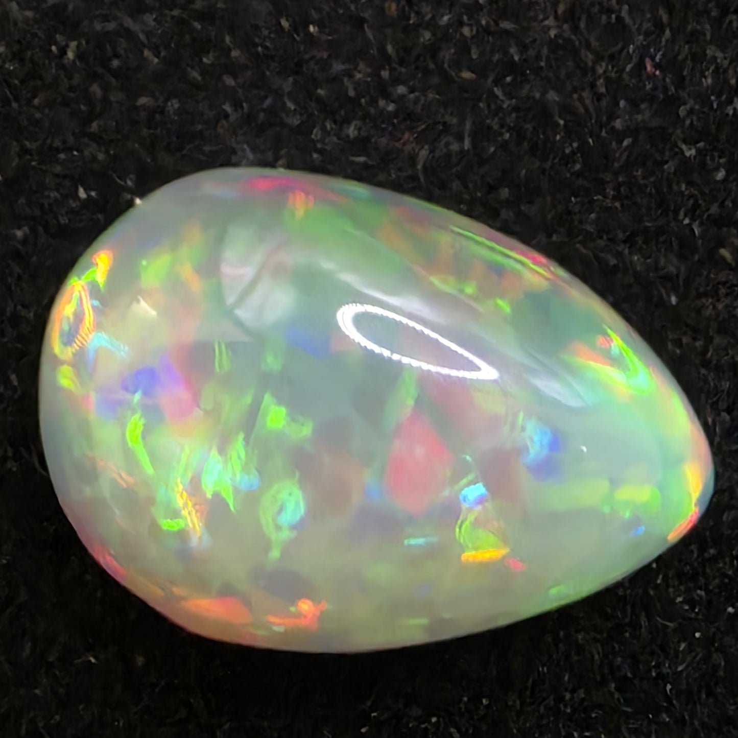 Black Opal special Ethiopian Welo, 4.55 ct pear polished, natural, intense Play-of-Colour