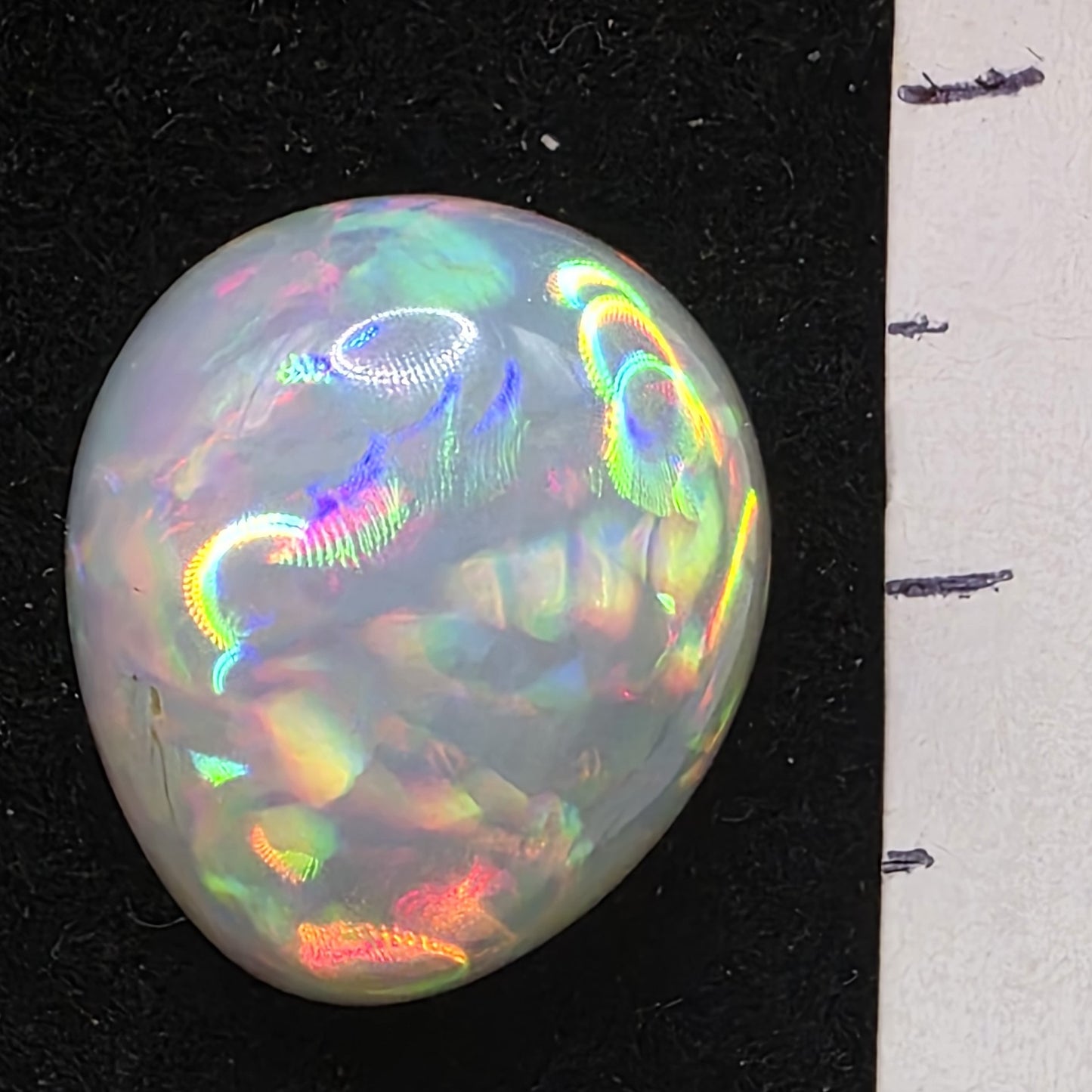 White Opal special Ethiopian Welo, 8.4 ct pear polished, natural, intense Play-of-Colour