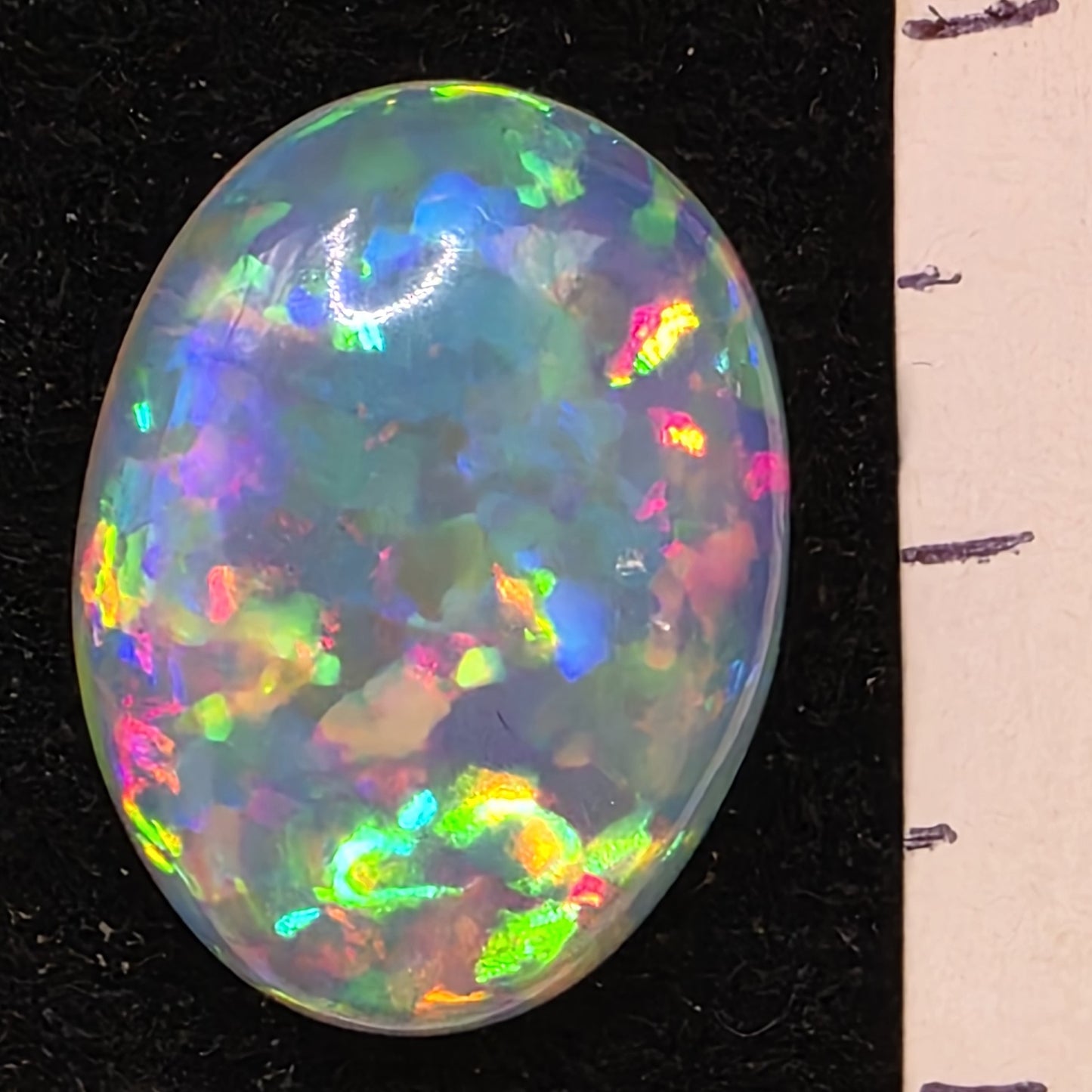 White Opal special Ethiopian Welo, 7.05 ct oval polished, natural, intense Play-of-Colour