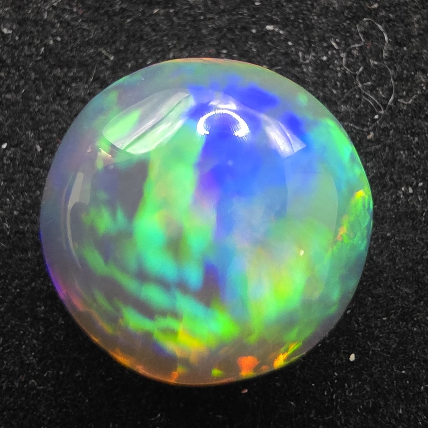 Crystal Opal special Ethiopian Welo, 5.6 ct round polished, natural, intense Play-of-Colour