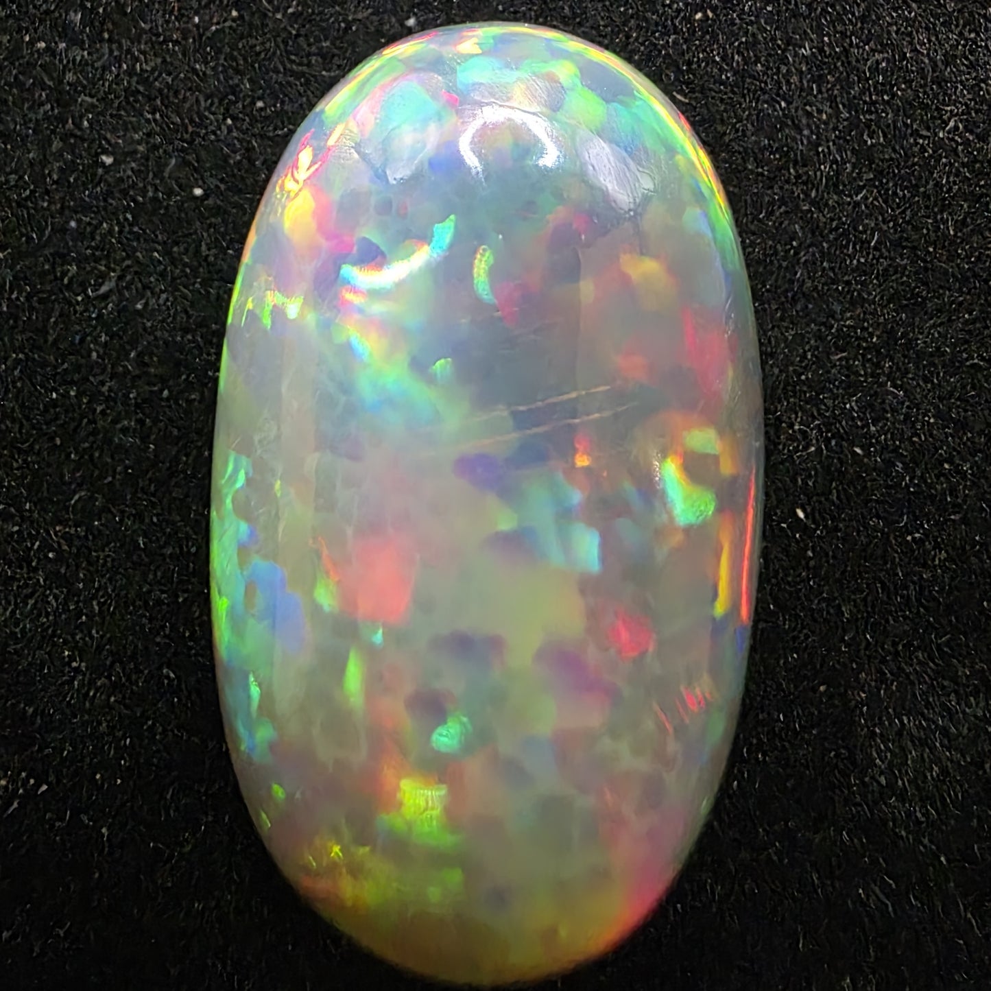 White Opal special Ethiopian Welo, 13.8 ct oval polished, natural, intense Play-of-Colour