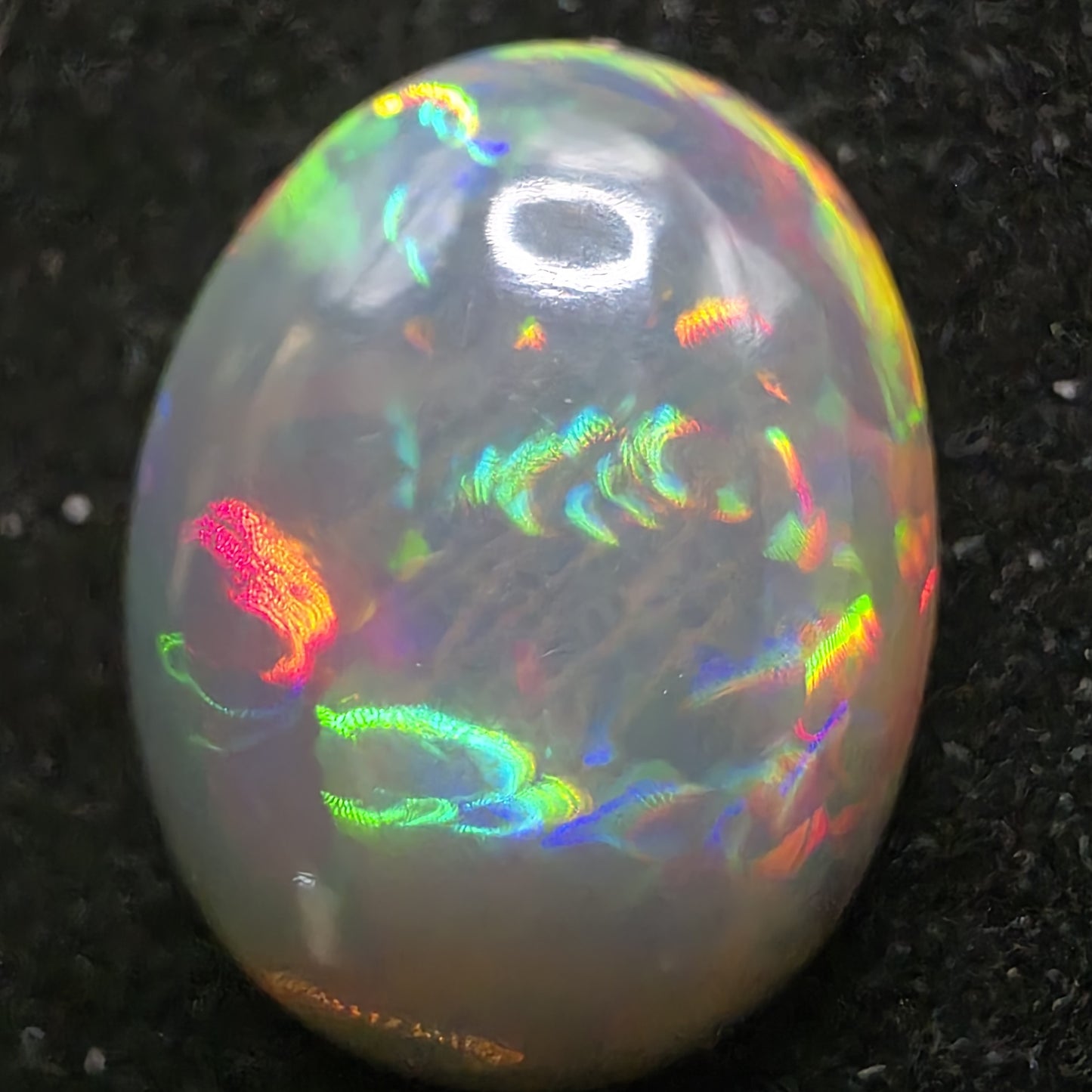 Black Opal special Ethiopian Welo, 7.45 ct oval polished, natural, intense Play-of-Colour