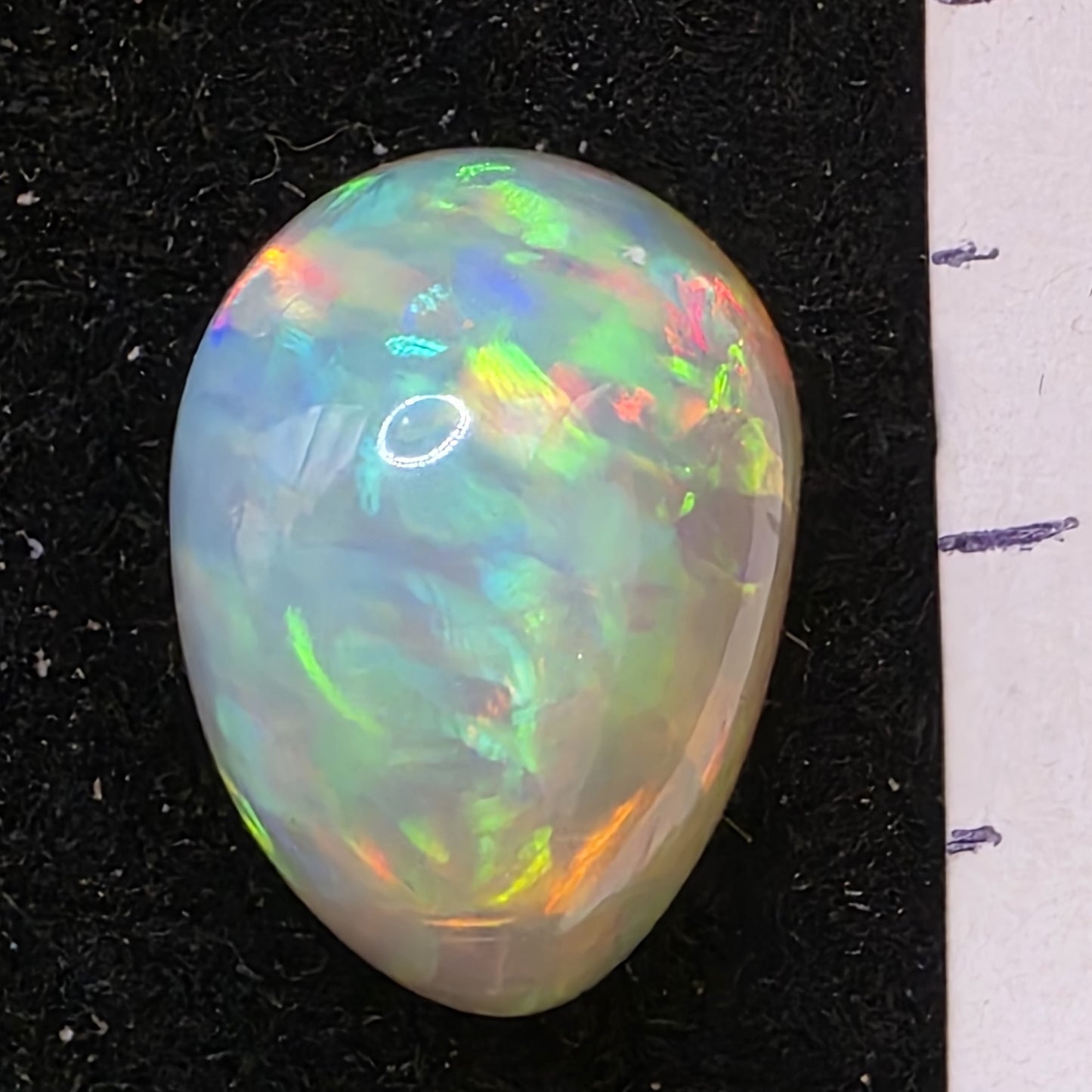 White Opal special Ethiopian Welo, 6.7 ct freeform polished, natural, intense Play-of-Colour
