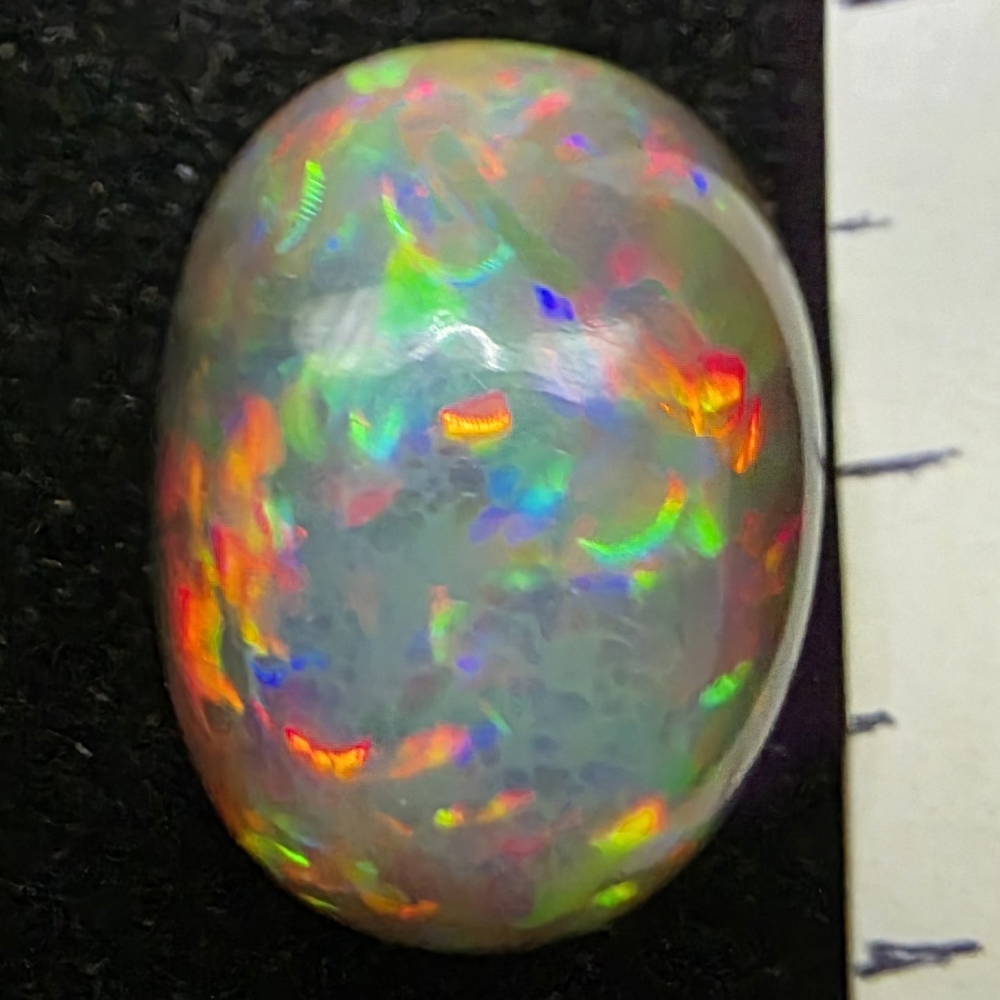 Black Opal special Ethiopian Welo, 9.55 ct oval polished, natural, intense Play-of-Colour