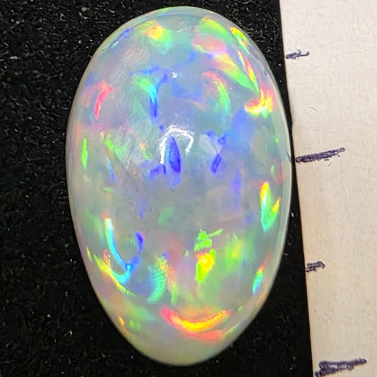 White Opal special Ethiopian Welo, 7.85 ct oval polished, natural, intense Play-of-Colour