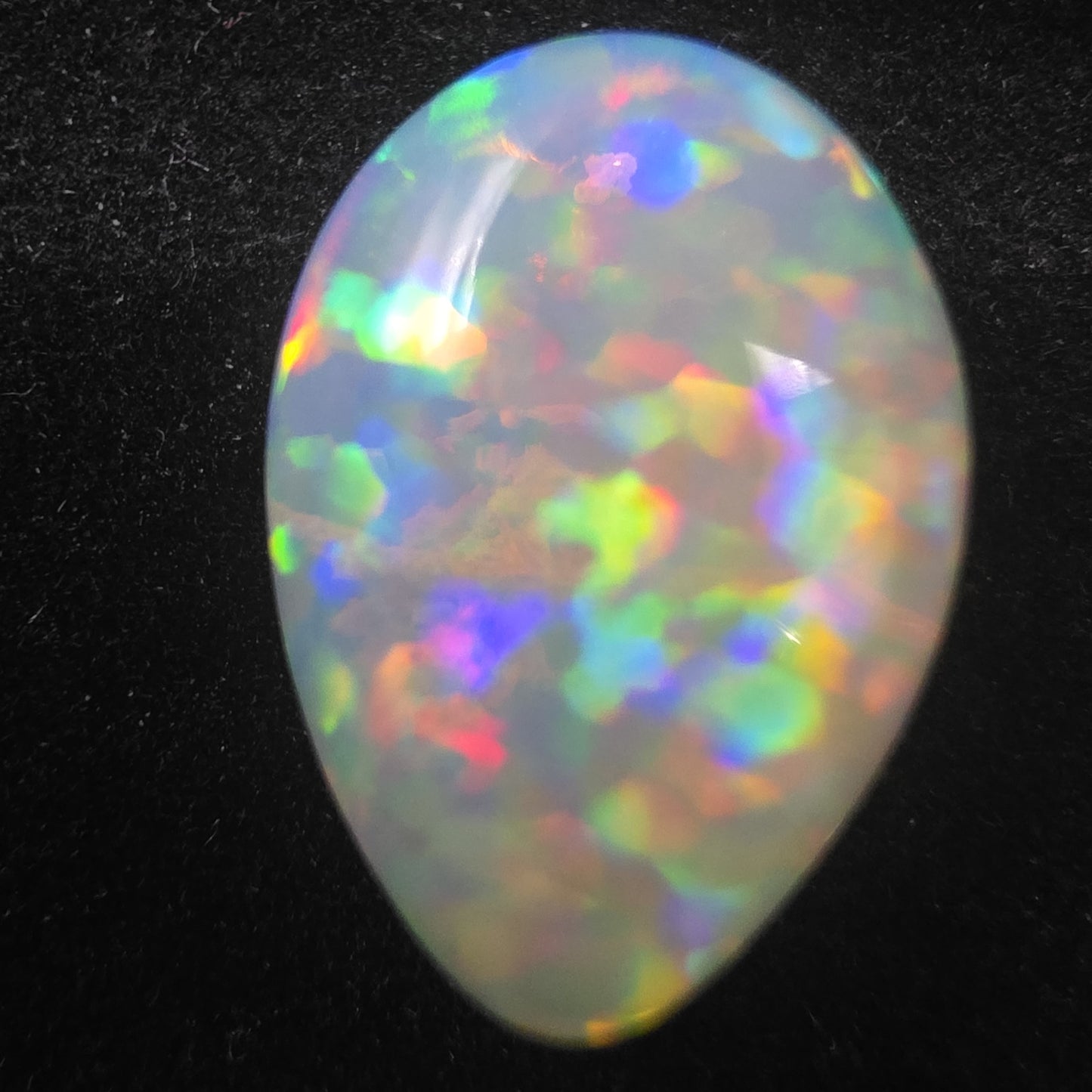 White Opal special Ethiopian Welo, 8.5 ct pear polished, natural, intense Play-of-Colour