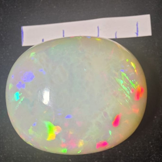 BIG stone! White Opal special Ethiopian Welo, 71.3 ct oval polished, natural, intense Play-of-Colour
