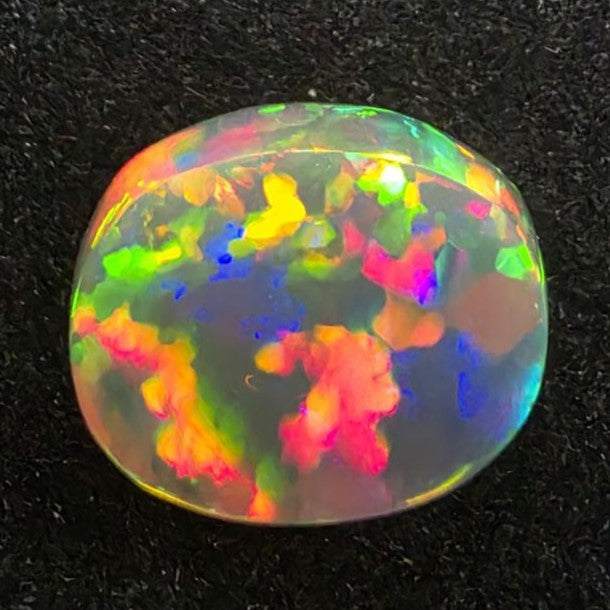 Black Opal special Ethiopian Welo, 6.65 ct oval polished, natural, intense Play-of-Colour