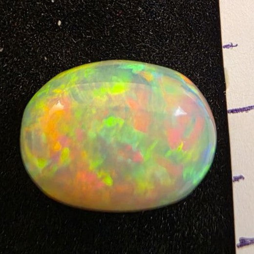 Black Opal special Ethiopian Welo, 5 ct oval polished, natural, intense Play-of-Colour