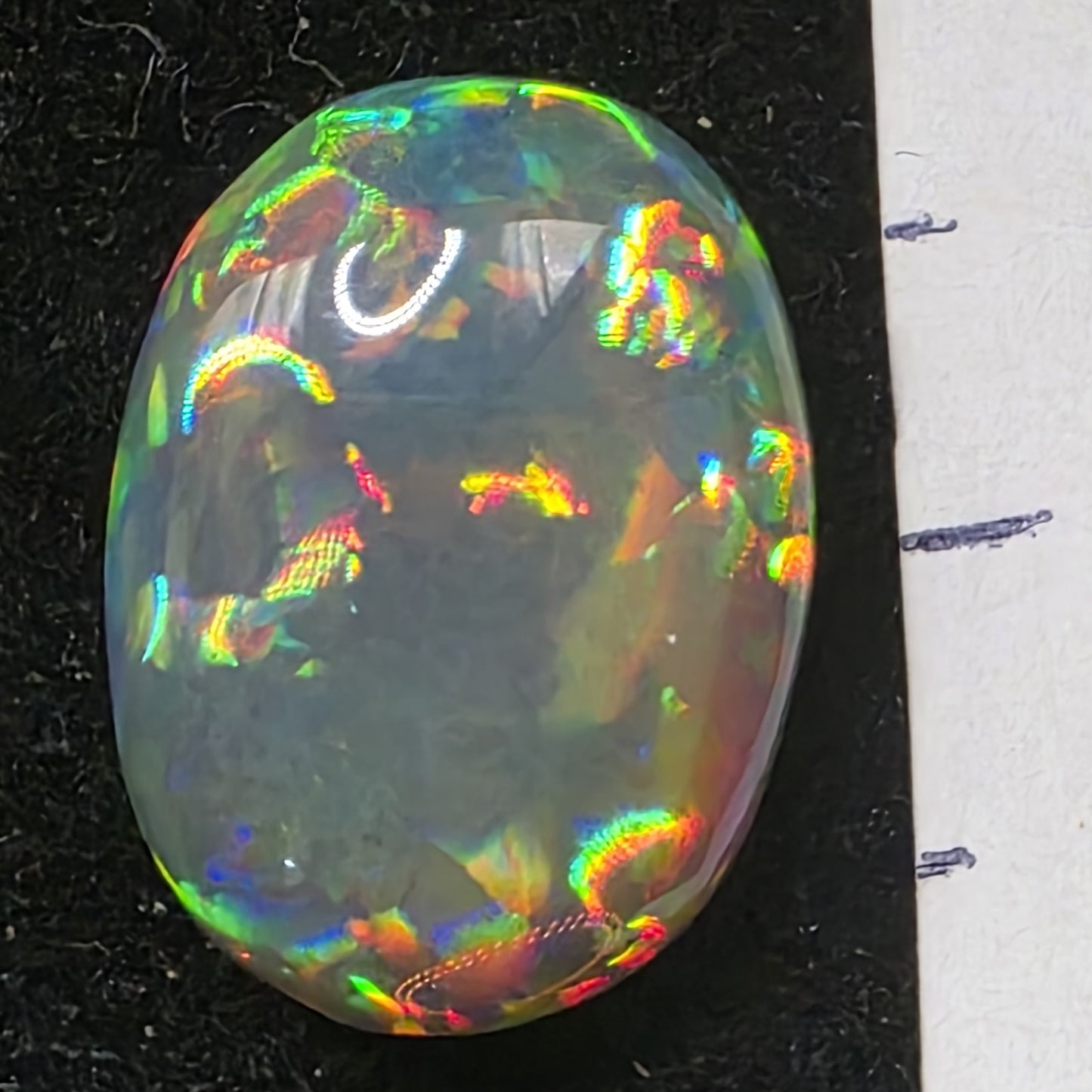 Black Opal special Ethiopian Welo, 5.4 ct oval polished, natural, intense Play-of-Colour