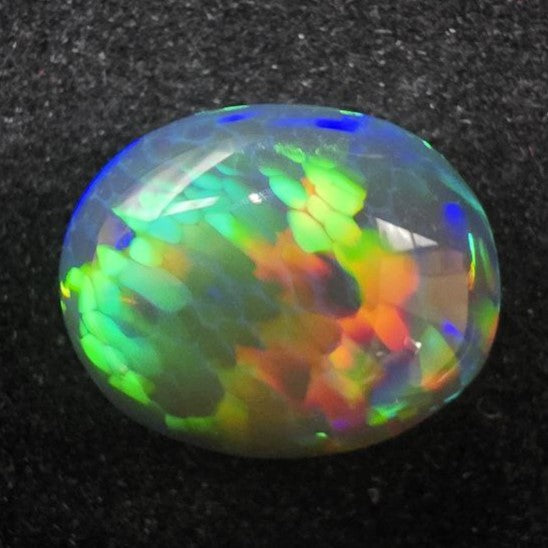 Black Opal special Ethiopian Welo, 6.65 ct oval polished, natural, intense Play-of-Colour