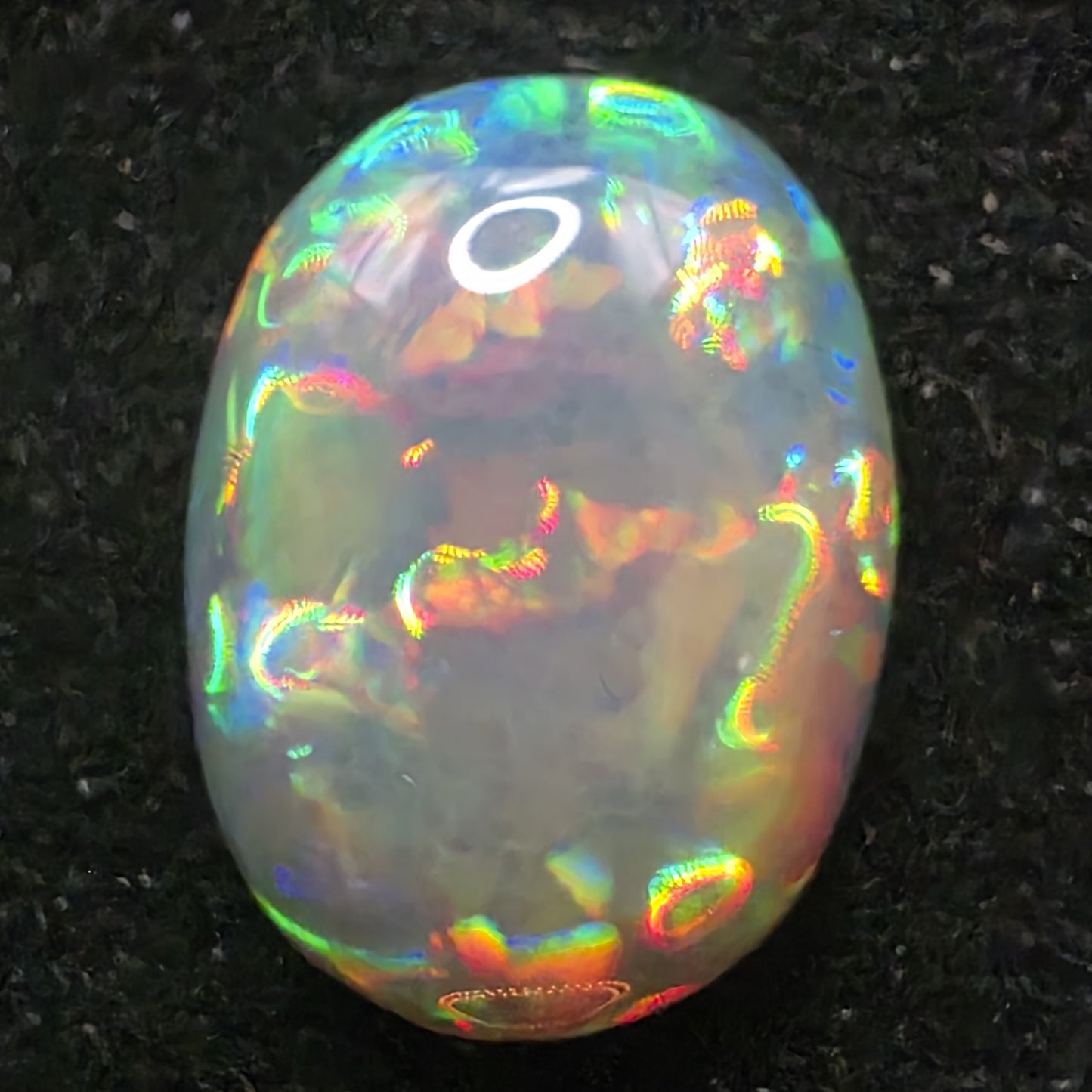 Black Opal special Ethiopian Welo, 5.4 ct oval polished, natural, intense Play-of-Colour