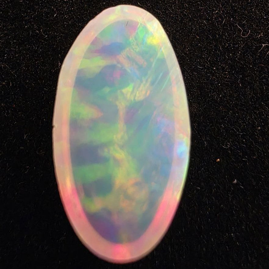 White Opal special Ethiopian Welo, 5.3 ct oval polished, natural, intense Play-of-Colour