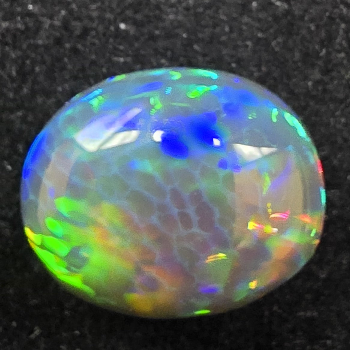 Black Opal special Ethiopian Welo, 6.65 ct oval polished, natural, intense Play-of-Colour