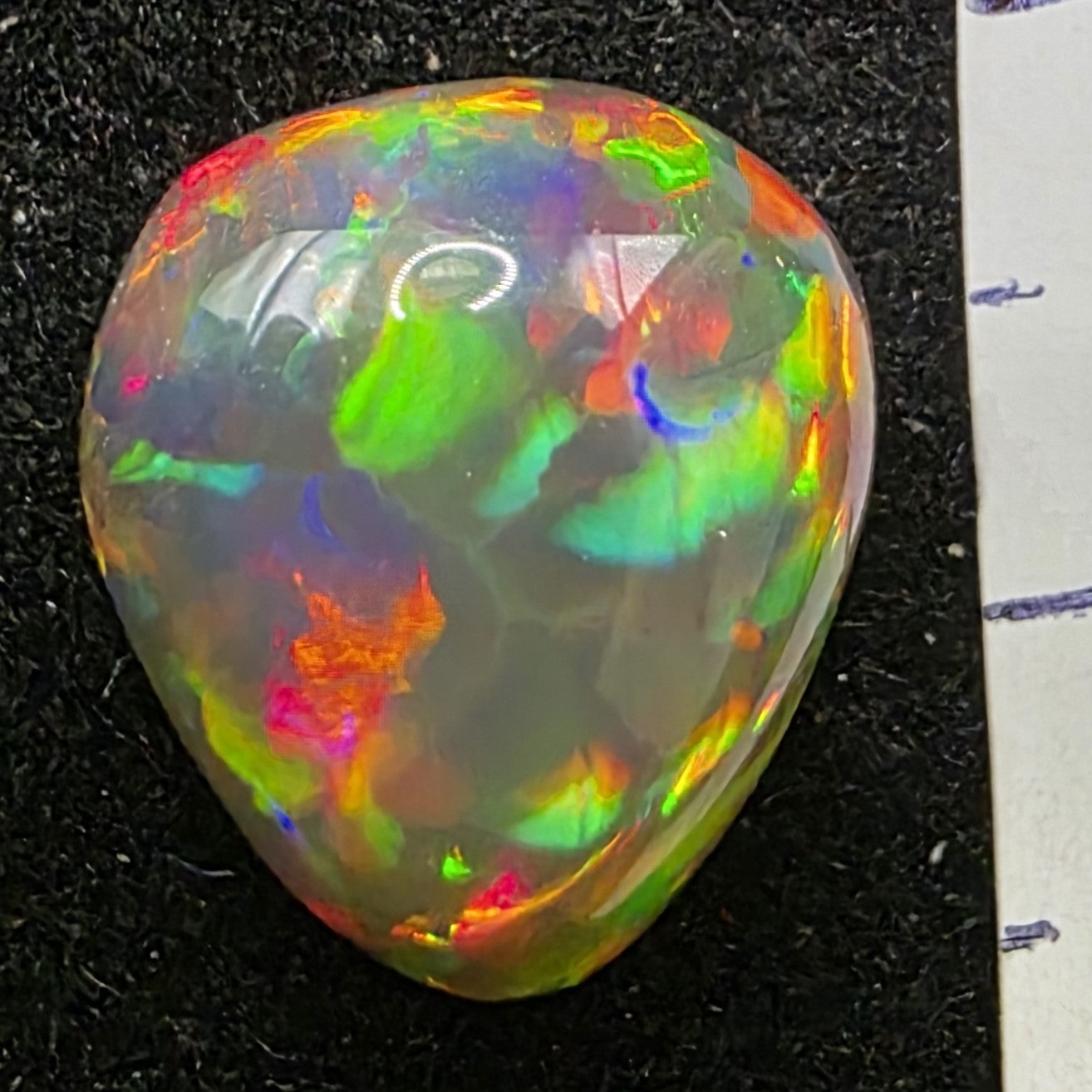 Black Opal special Ethiopian Welo, 5.6 ct pear polished, natural, intense Play-of-Colour