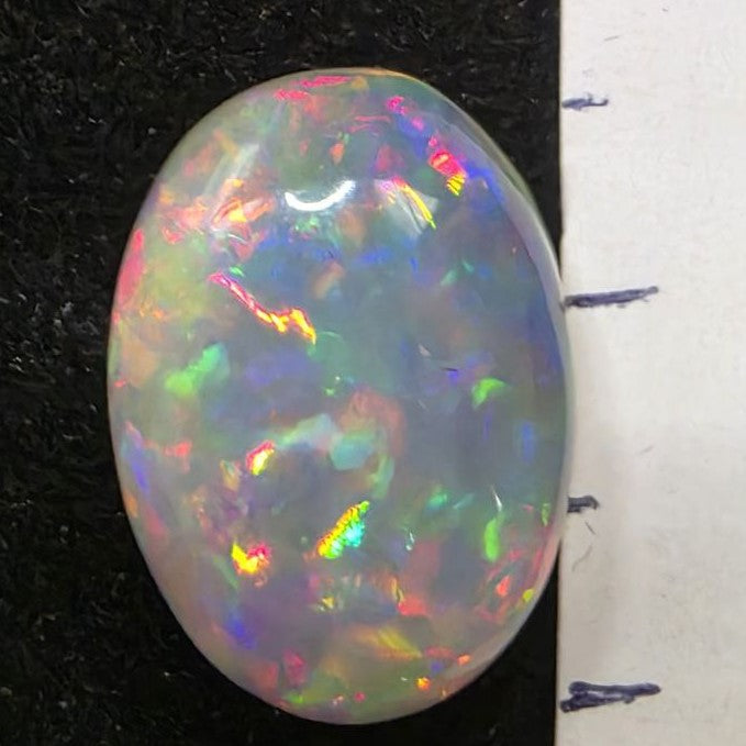 Black Opal special Ethiopian Welo, 6.2 ct oval polished, natural, intense Play-of-Colour