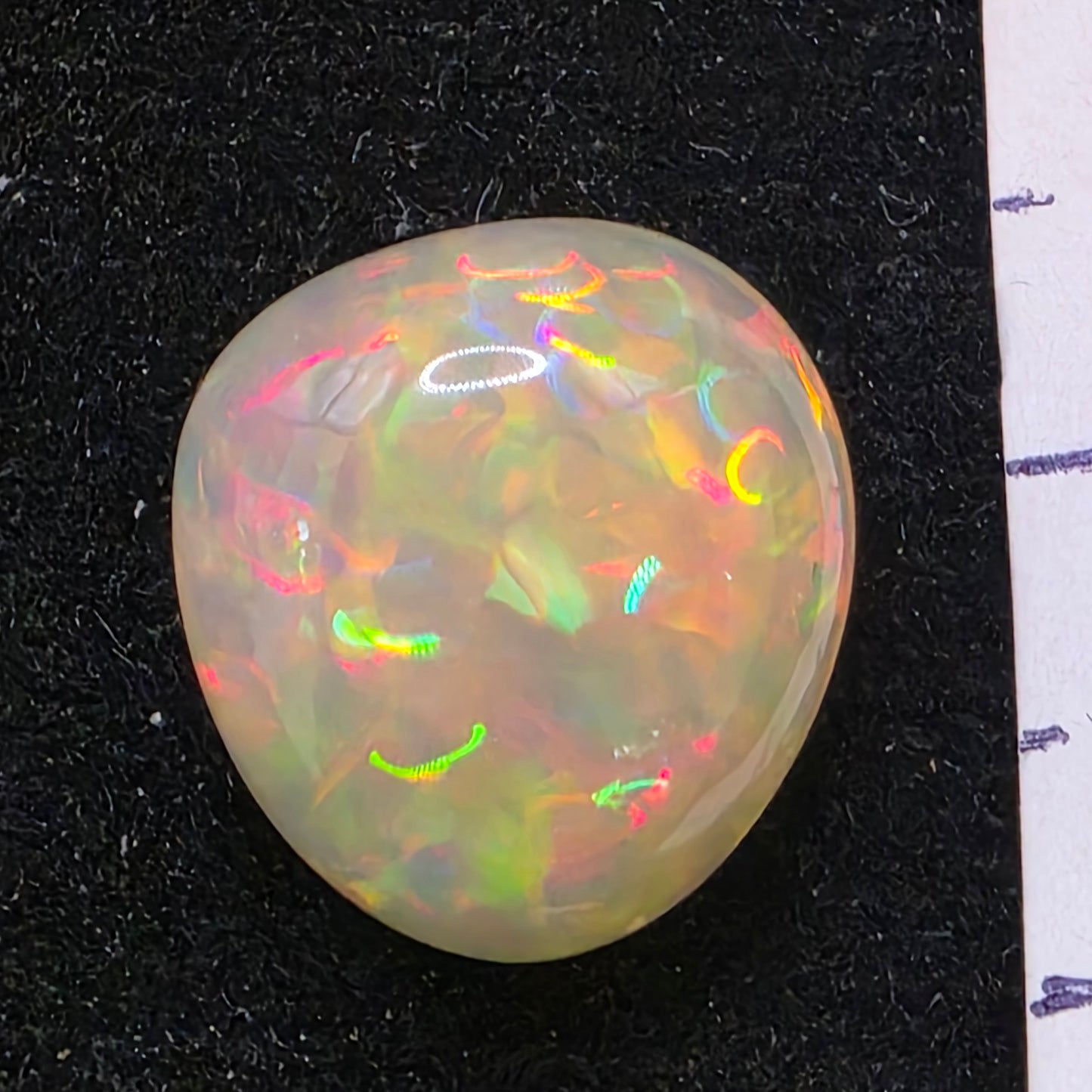 Honey Opal special Ethiopian Welo, 6.4 ct freeform polished, natural, intense Play-of-Colour