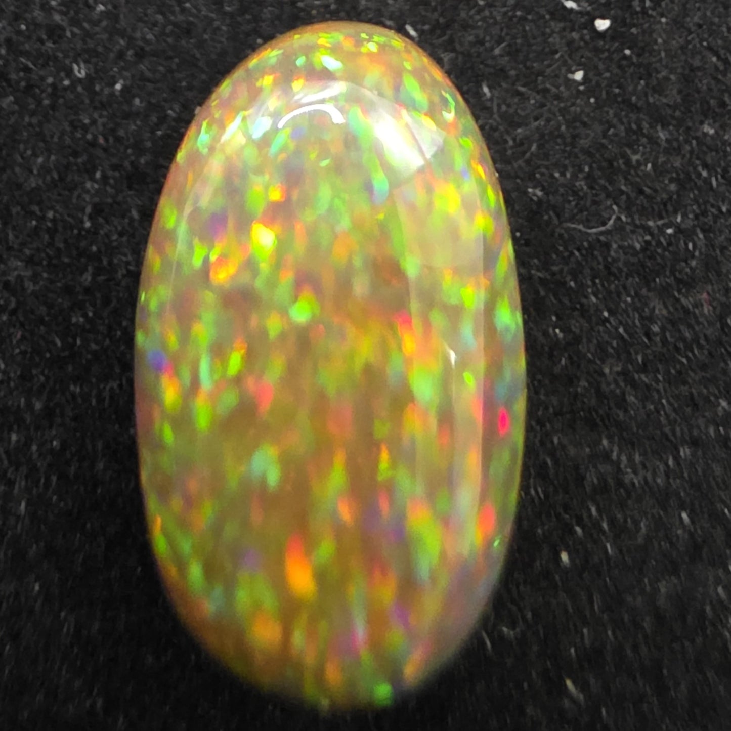 Black Opal special Ethiopian Welo, 4.1 ct oval polished, natural, intense Play-of-Colour
