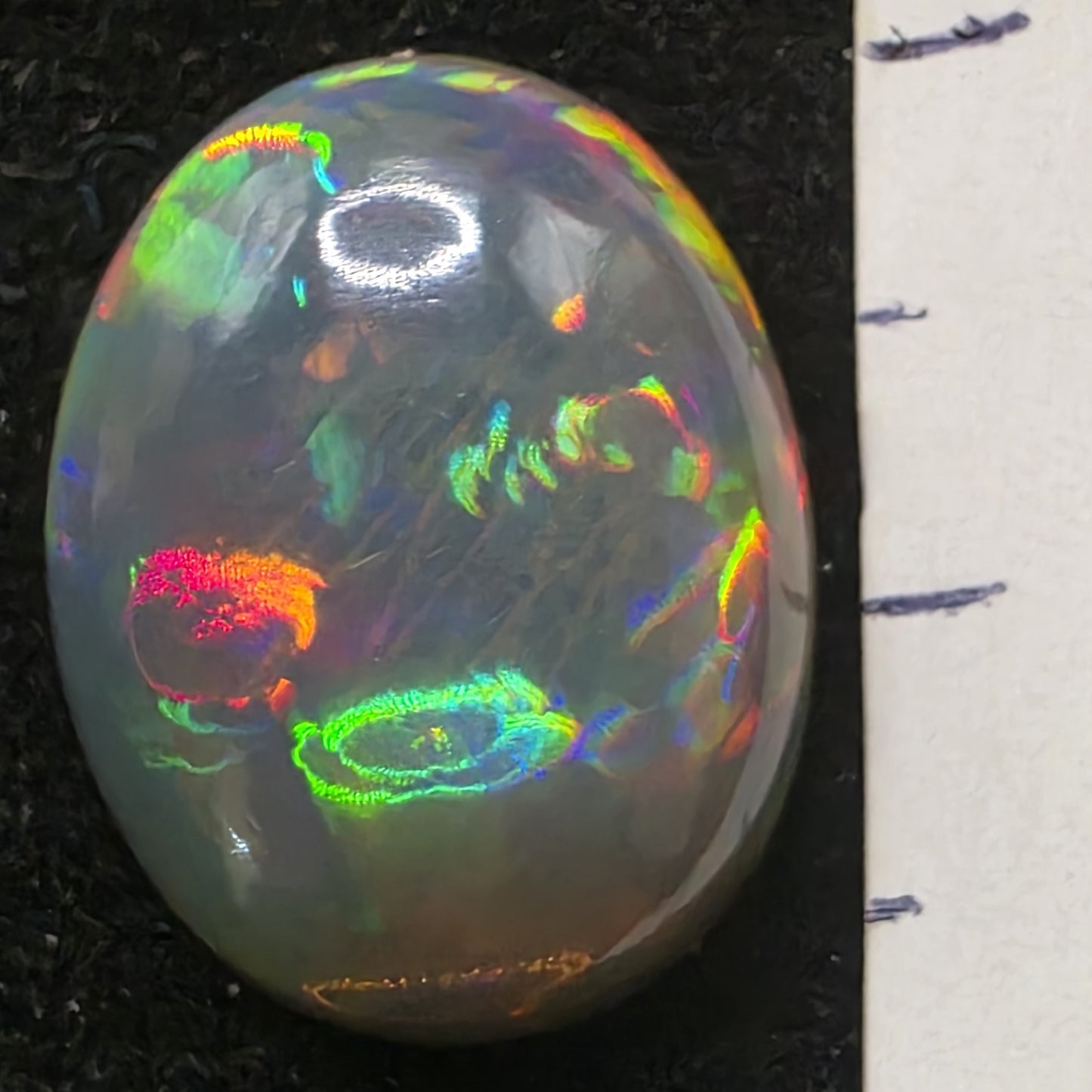 Black Opal special Ethiopian Welo, 7.45 ct oval polished, natural, intense Play-of-Colour