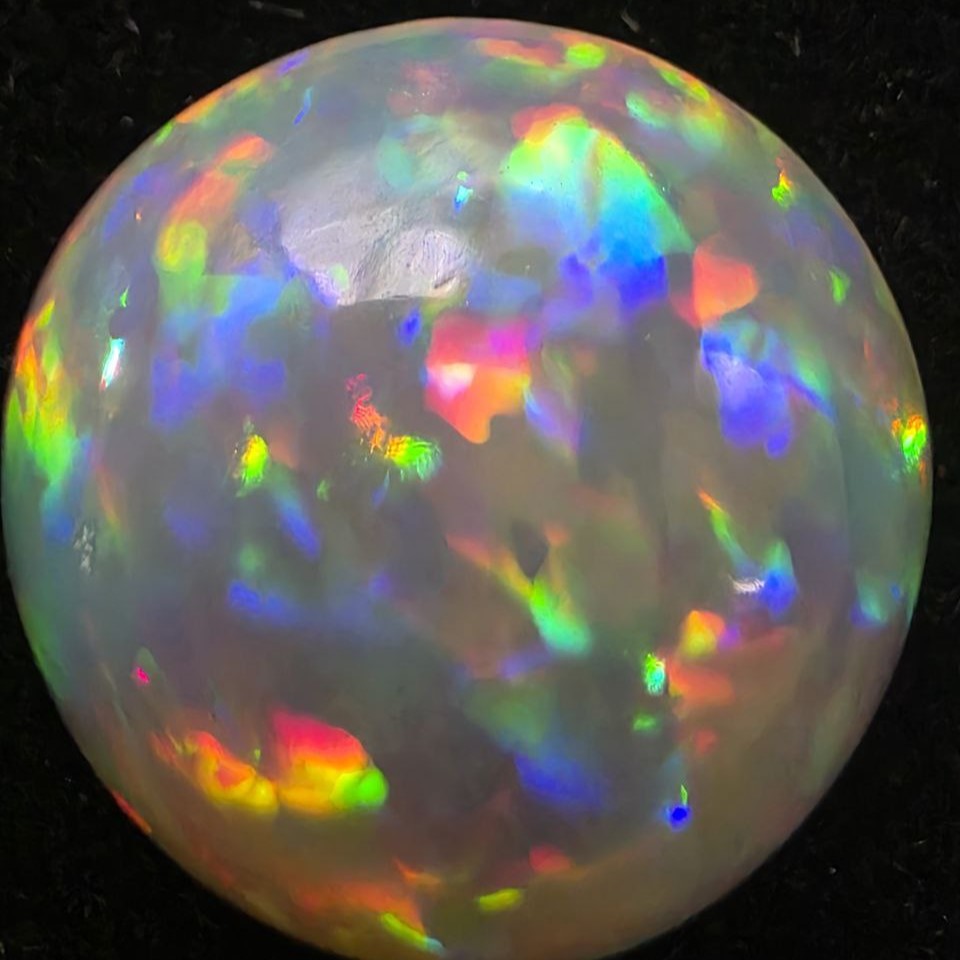 Black Opal special Ethiopian Welo, 5 ct round polished, natural, intense Play-of-Colour
