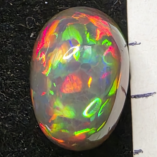 Black Opal special Ethiopian Welo, 6.05 ct oval polished, natural, intense Play-of-Colour