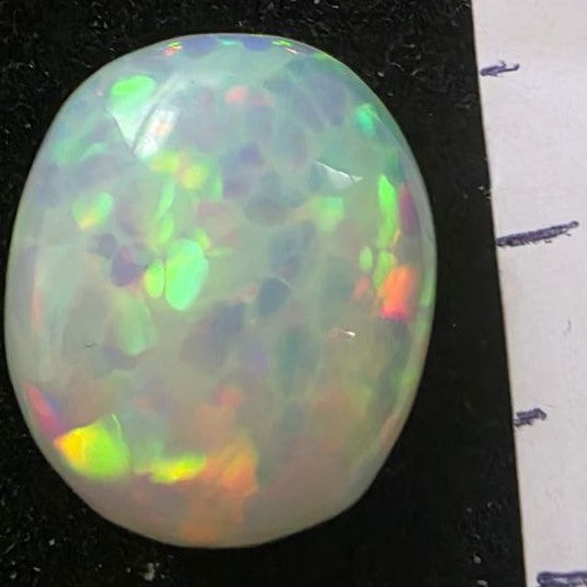 White Opal special Ethiopian Welo, 4.5 ct oval polished, natural, intense Play-of-Colour