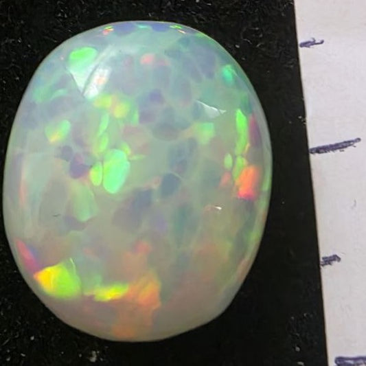 White Opal special Ethiopian Welo, 4.5 ct oval polished, natural, intense Play-of-Colour