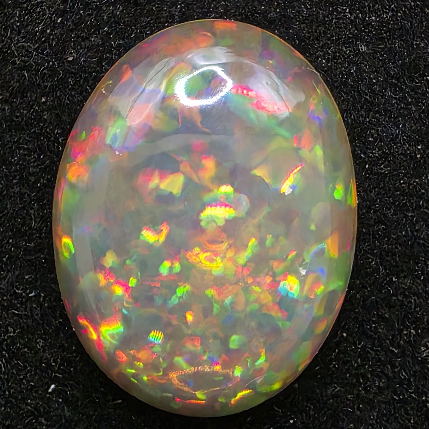 Black Opal special Ethiopian Welo, 7.15 ct oval polished, natural, intense Play-of-Colour
