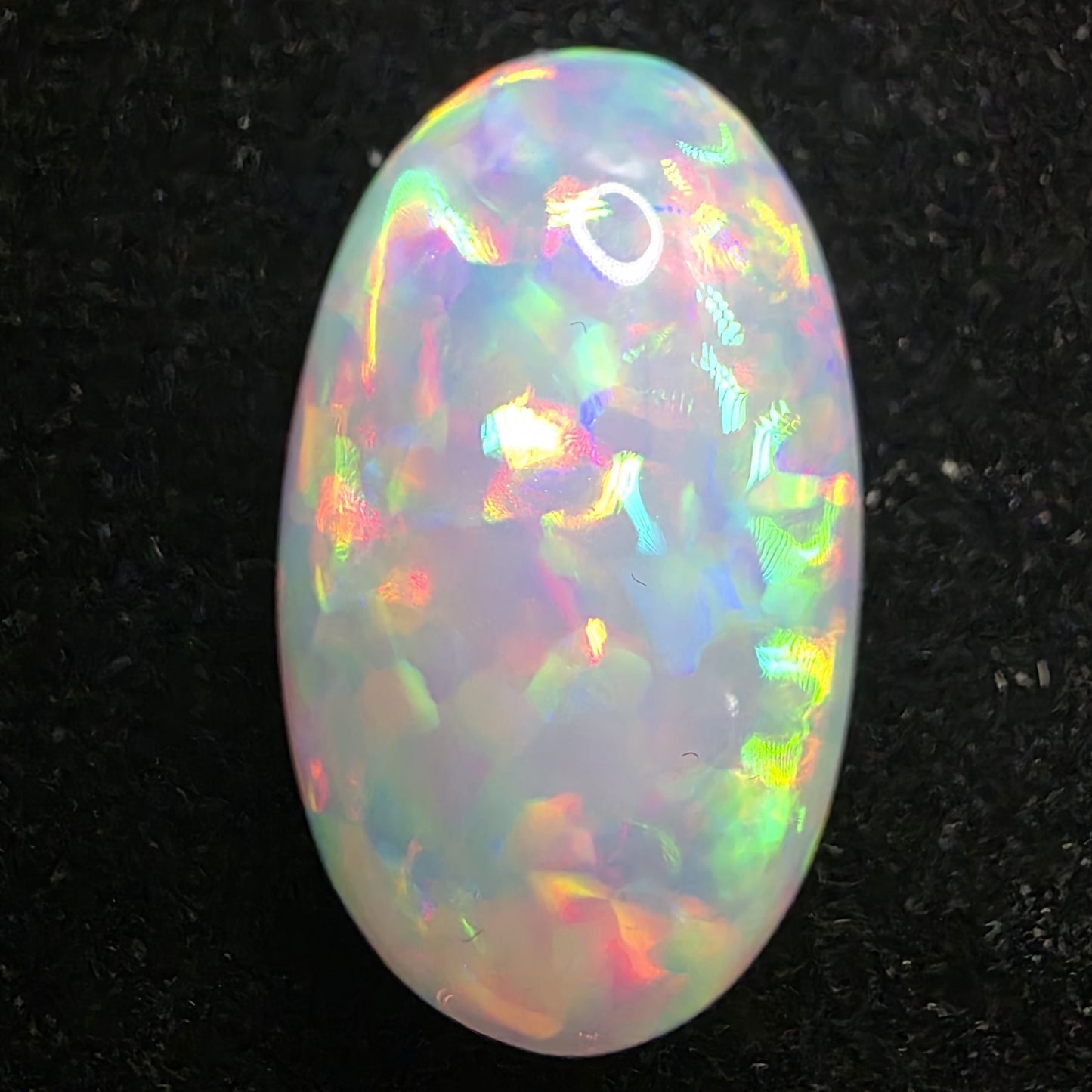 White Opal special Ethiopian Welo, 13.05 ct oval polished, natural, intense Play-of-Colour