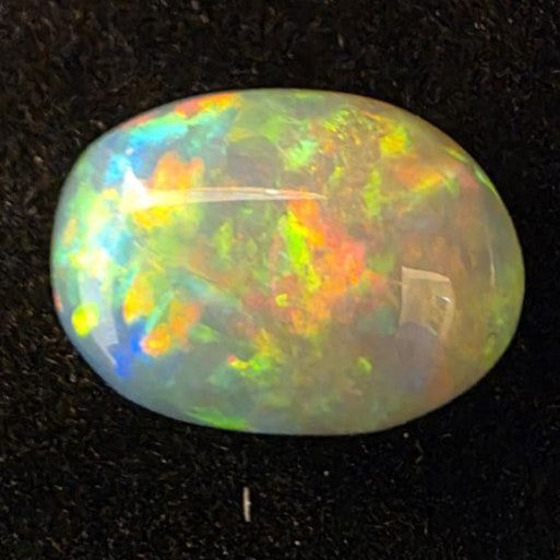 Black Opal special Ethiopian Welo, 5 ct oval polished, natural, intense Play-of-Colour