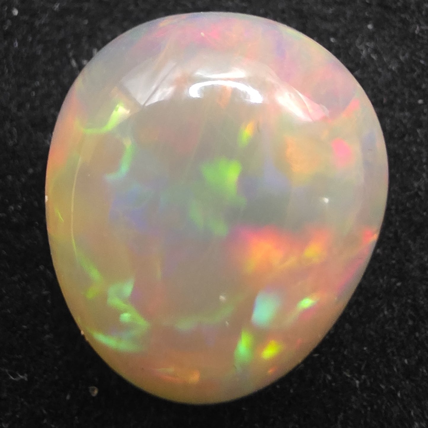 White Opal special Ethiopian Welo, 9.3 ct pear polished, natural, intense Play-of-Colour