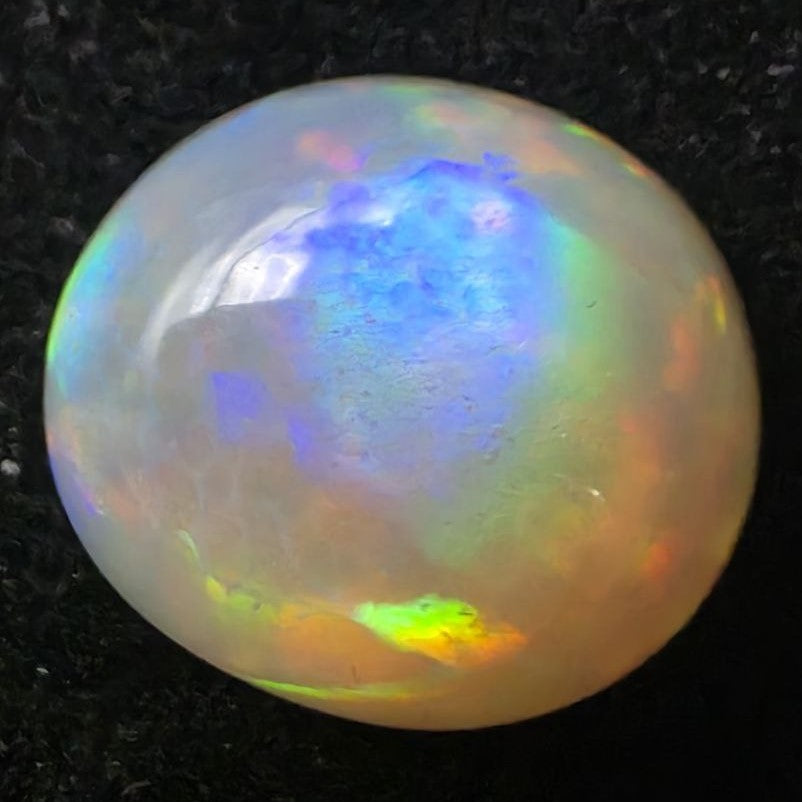 Black Opal special Ethiopian Welo, 7.25 ct oval polished, natural, intense Play-of-Colour