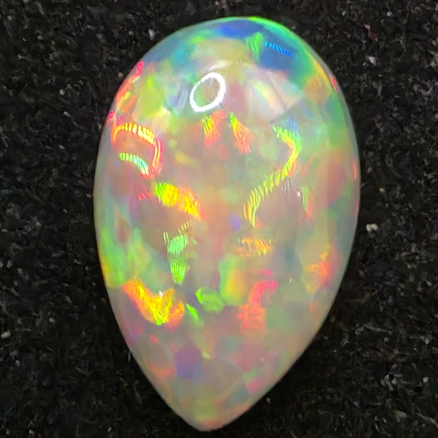 Black Opal special Ethiopian Welo, 6.1 ct pear polished, natural, intense Play-of-Colour