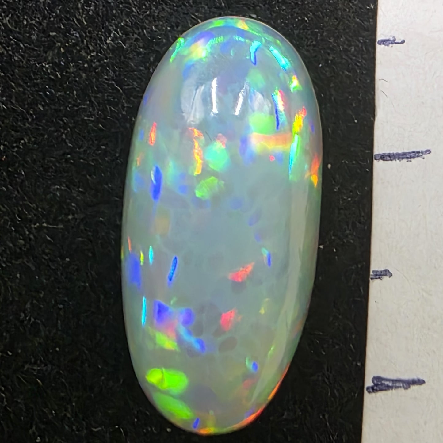 White Opal special Ethiopian Welo, 4.2 ct oval polished, natural, intense Play-of-Colour