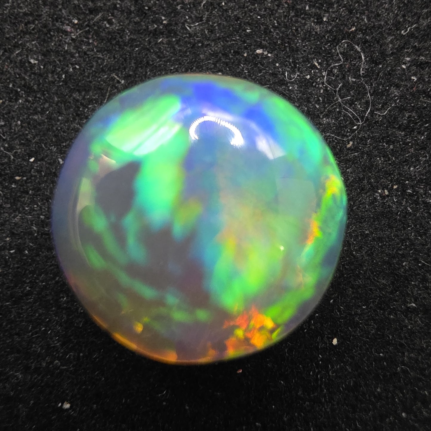 Crystal Opal special Ethiopian Welo, 5.6 ct round polished, natural, intense Play-of-Colour