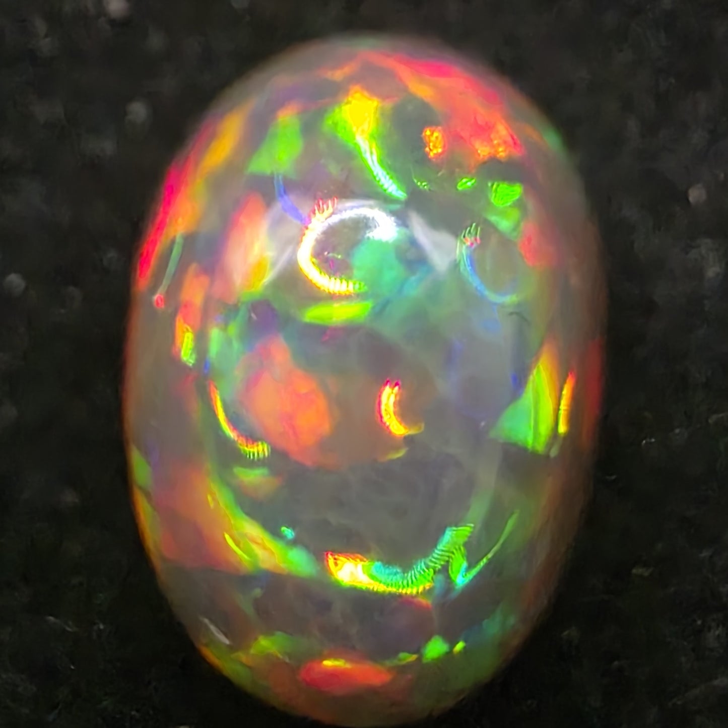 Black Opal special Ethiopian Welo, 6.05 ct oval polished, natural, intense Play-of-Colour
