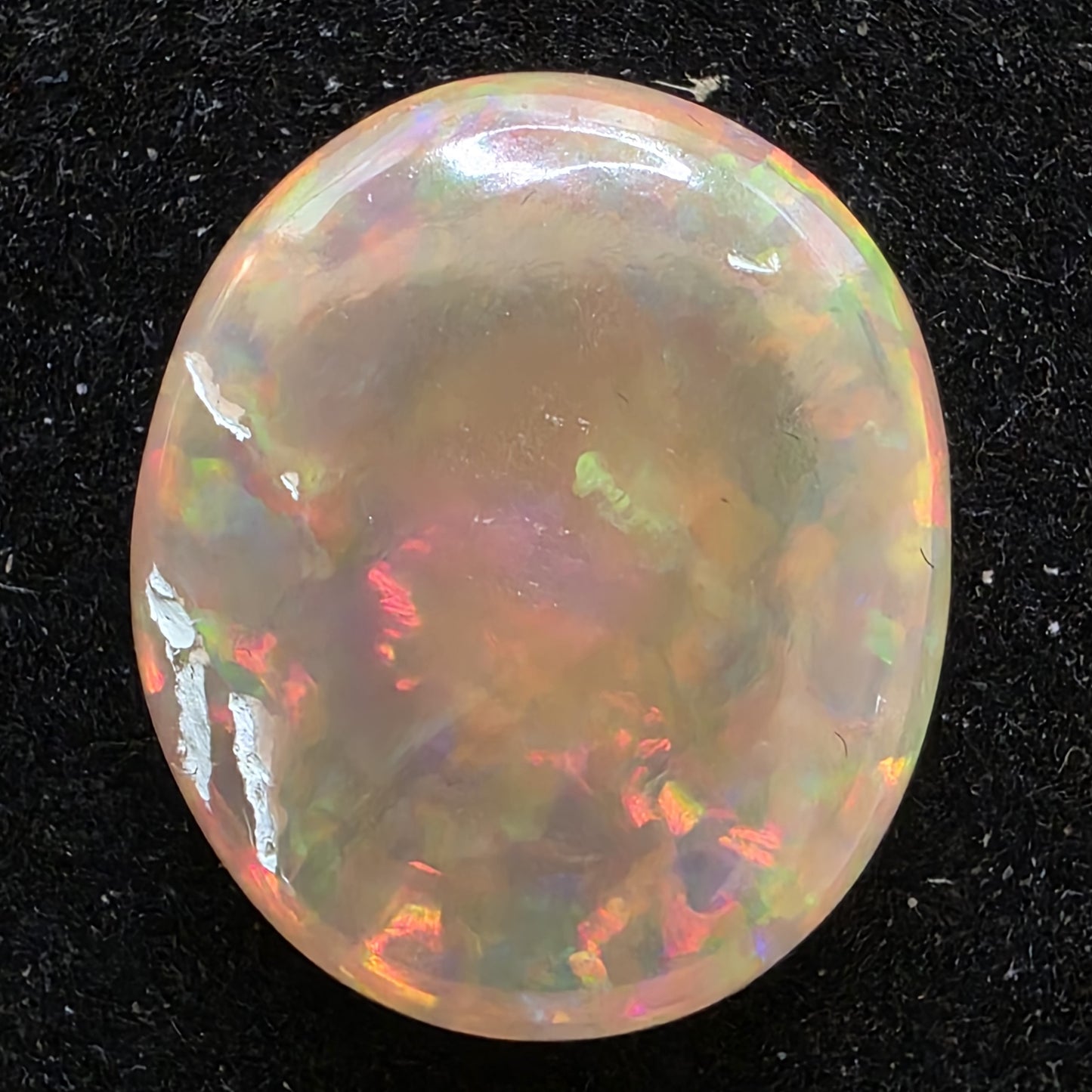 Black Opal special Ethiopian Welo, 6.65 ct oval polished, natural, intense Play-of-Colour