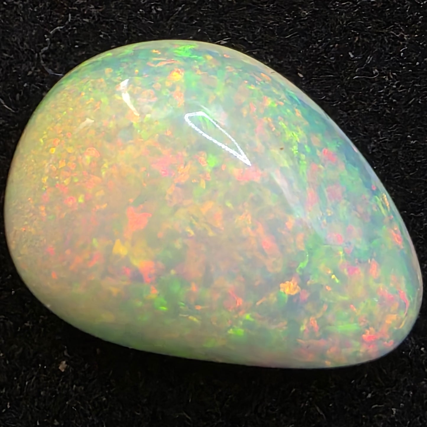 White Opal special Ethiopian Welo, 6.7 ct freeform polished, natural, intense Play-of-Colour
