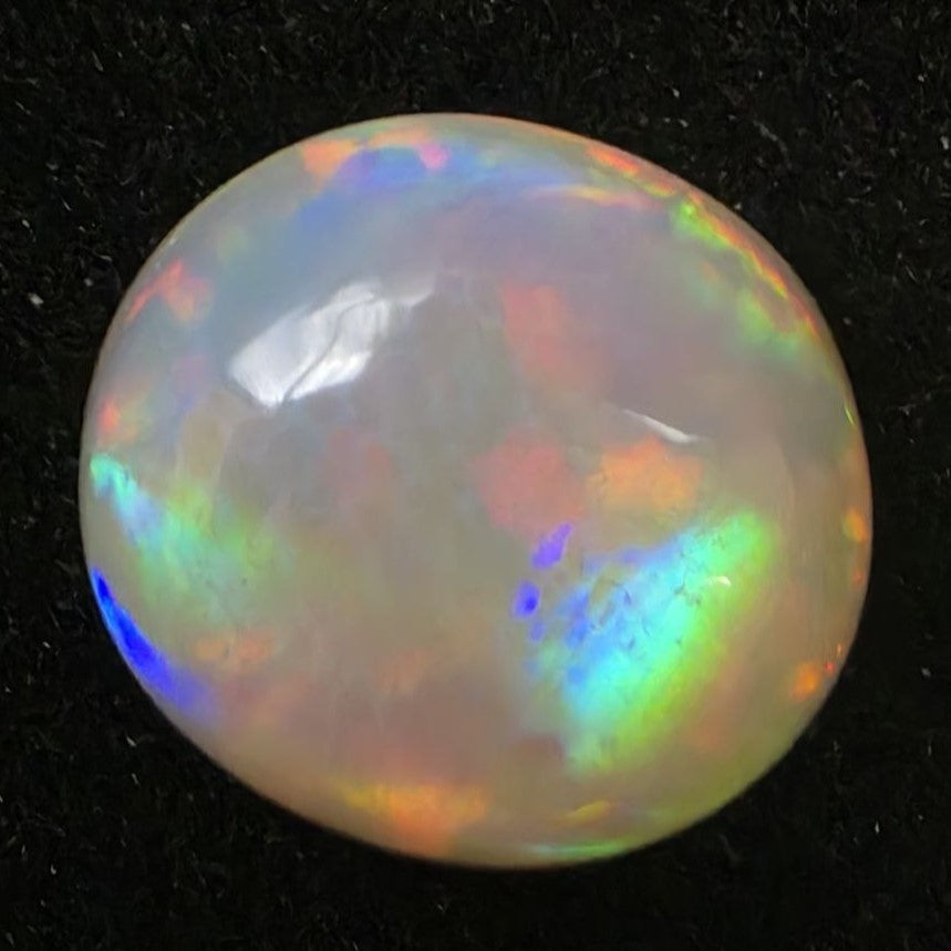 Black Opal special Ethiopian Welo, 7.25 ct oval polished, natural, intense Play-of-Colour